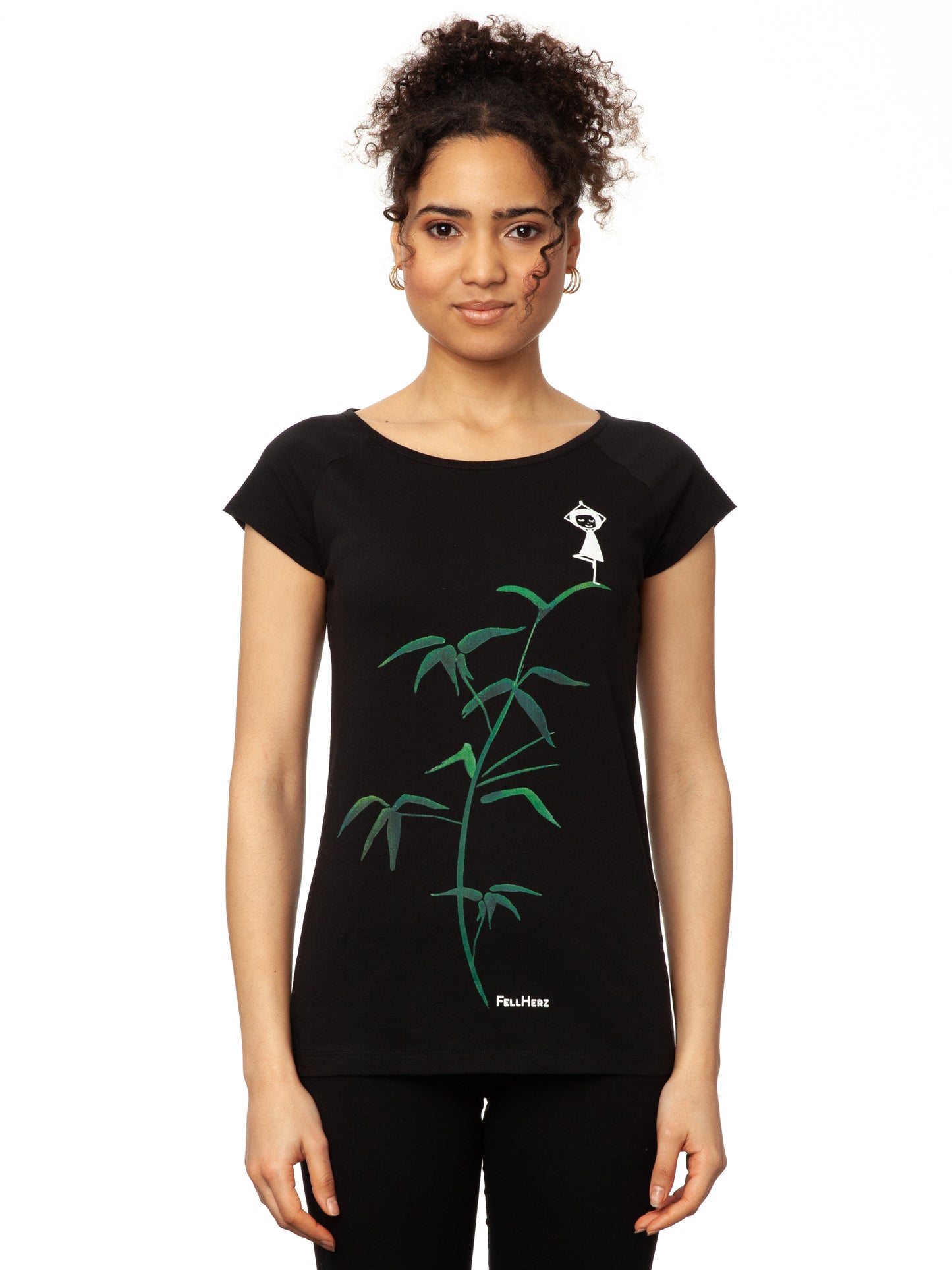 FellHerz schwarzes Yoga-Mädchen Damen T-Shirt aus Bio-Baumwolle. Schwarzes Raglan-Shirt mit Print: Ein Mädchen in Yogapose steht auf einem grünen Bambus-Ast.
